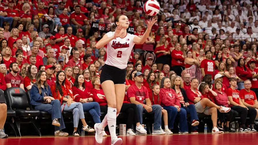 Fans sitting courtside watching game