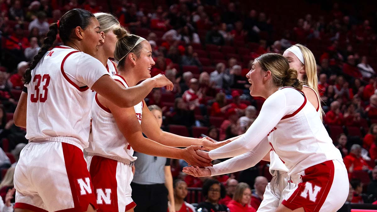 Women's Basketball players celebrating