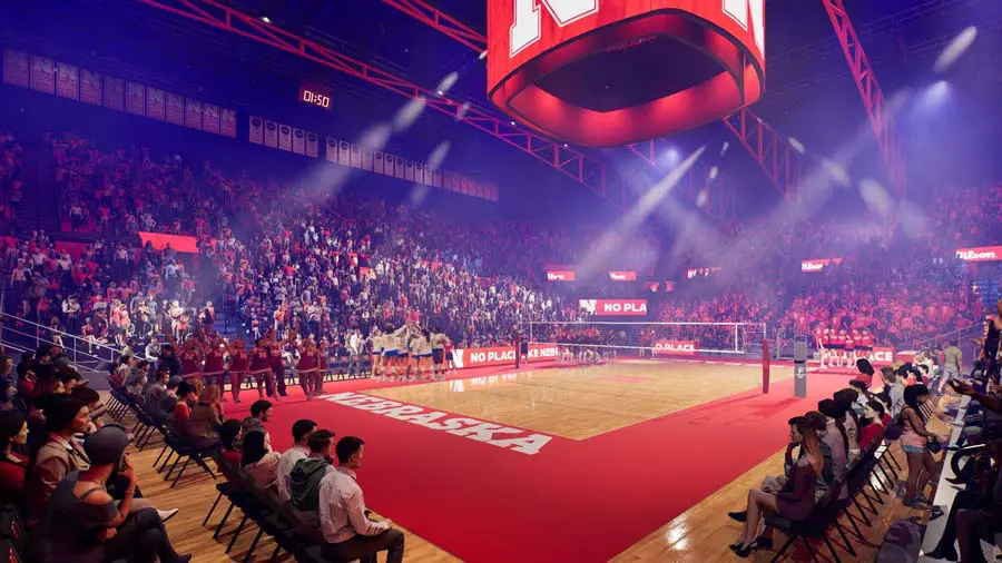 Fans sitting courtside watching game